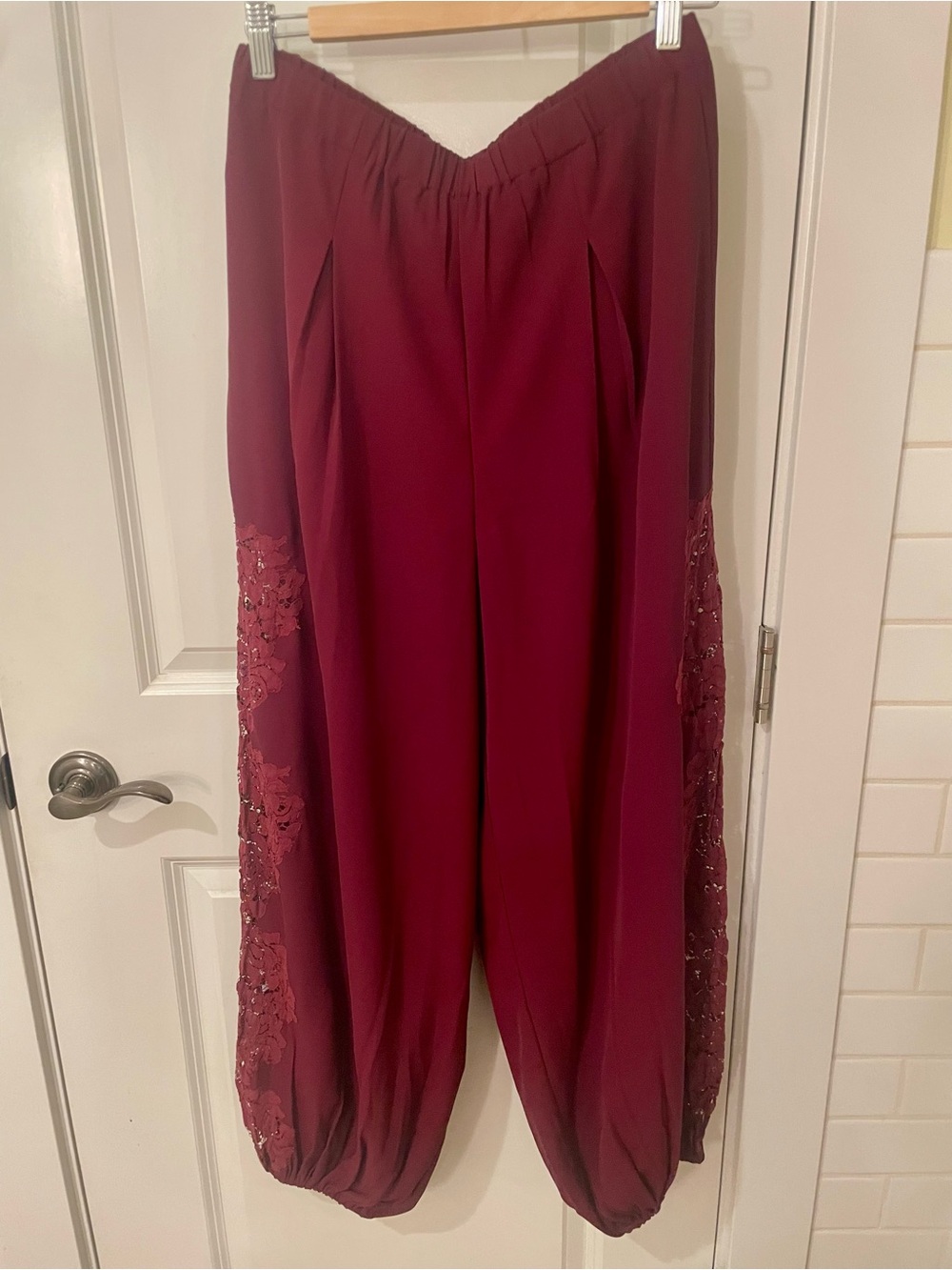 Burgundy jogger pants with lace detail